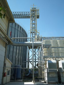 A protected bucket elevator is shown at a processing plant.