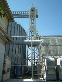 A protected bucket elevator is shown at a processing plant. A protected bucket elevator is shown at a processing plant.