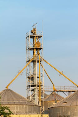 Figure 4: To convey to multiple destinations, a bucket elevator’s outlet can feed a gravity diverter valve with spouting to each destination. Figure 4: To convey to multiple destinations, a bucket elevator’s outlet can feed a gravity diverter valve with spouting to each destination.