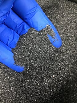Considering how materials such as this activated carbon will flow through a process and between processing steps without hangups is critical to designing a successful system.