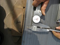 A FEECO customer service engineer uses a caliper to measure the gap of the tire keeper wear. A FEECO customer service engineer uses a caliper to measure the gap of the tire keeper wear.