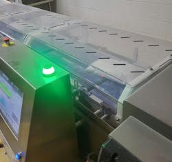 A plastic cover prevents flour buildup on the Raptor's conveyor. A plastic cover prevents flour buildup on the Raptor's conveyor.