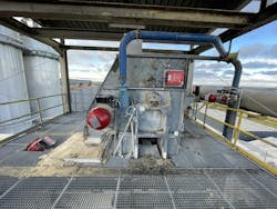 Figure 1. If a dust explosion occurs in the head of this bucket elevator, the IPD system from BS&B (left) suppresses it in a fraction of a second with a chemical extinguishing agent.