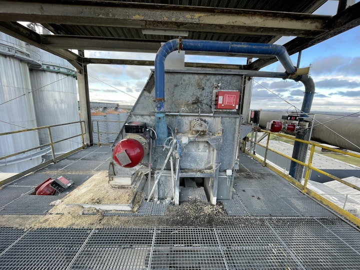 Figure 1. If a dust explosion occurs in the head of this bucket elevator, the IPD system from BS&B (left) suppresses it in a fraction of a second with a chemical extinguishing agent.