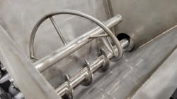 An internal agitation system in the feeder hopper is essential for breaking up clumps and preventing bridging with difficult materials.