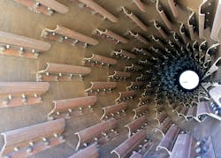 Figure 3. Internal lifting flights create a “curtain” of cascading material across the drum’s cross section, maximizing heat transfer between the material and products of combustion. Figure 3. Internal lifting flights create a “curtain” of cascading material across the drum’s cross section, maximizing heat transfer between the material and products of combustion.