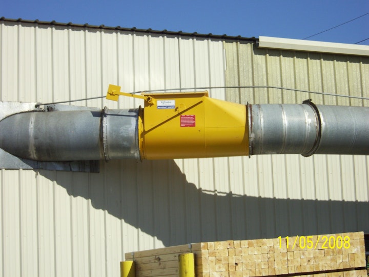 Figure 1. A back-draft damper provides passive isolation on a dust collection duct.
