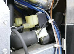 Valve assembly mounted in a beverage processing system for compact fluid control. Valve assembly mounted in a beverage processing system for compact fluid control.