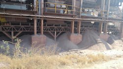 Fugitive material accumulating beneath a belt conveyor Fugitive material accumulating beneath a belt conveyor