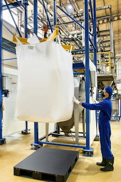 A cantilevered I-beam, hoist and trolley lifts and positions a 1-tonne (2,200-lb) bulk bag into the discharger frame without the need for a forklift, A cantilevered I-beam, hoist and trolley lifts and positions a 1-tonne (2,200-lb) bulk bag into the discharger frame without the need for a forklift,