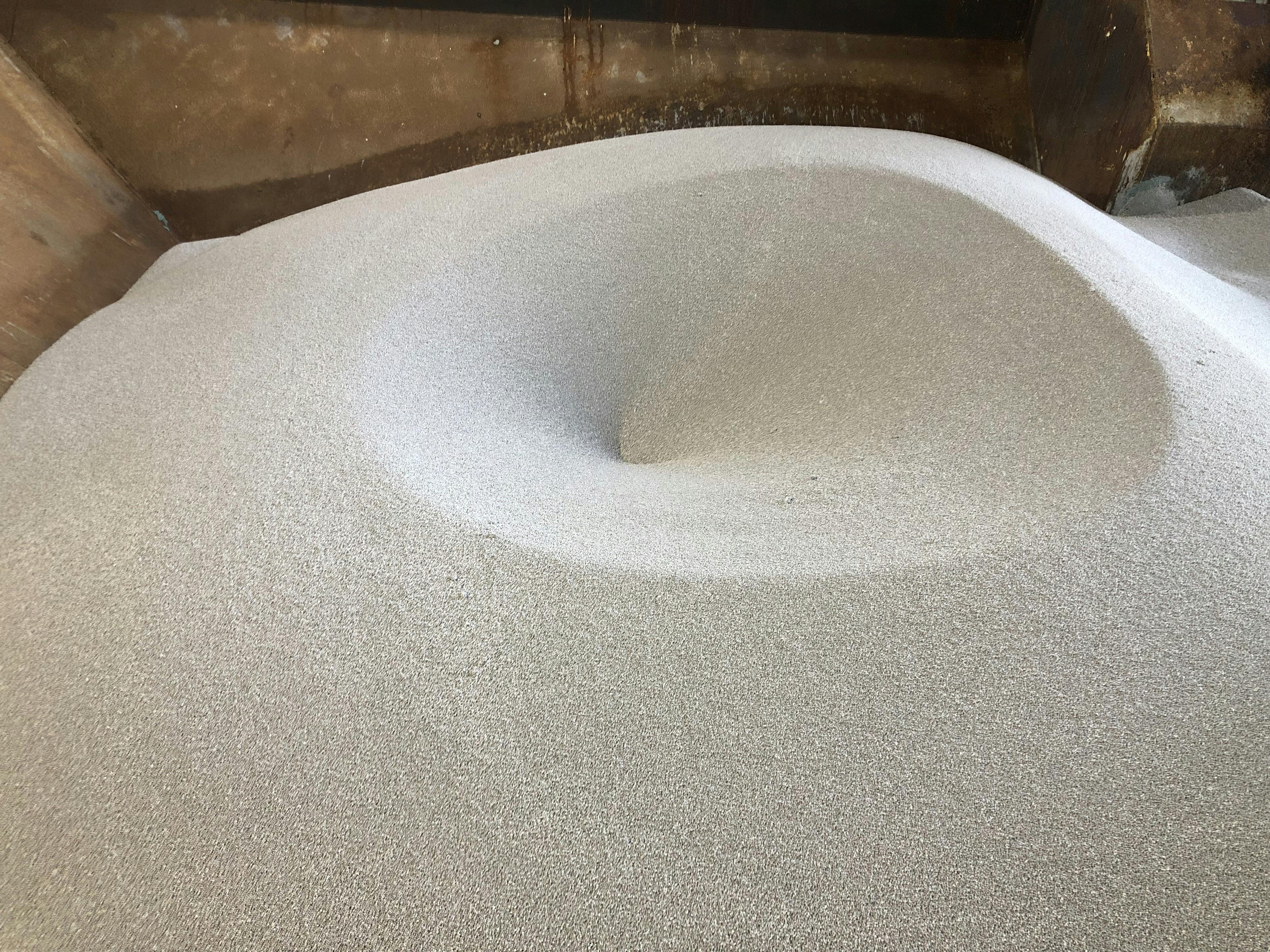 Bulk solid material in storage vessel