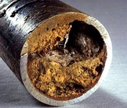 Figure 3. Severe iron oxide deposition in a carbon steel pipe.3 Figure 3. Severe iron oxide deposition in a carbon steel pipe.3