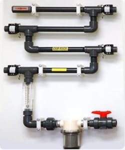 Figure 7. Example of a corrosion coupon layout for a cooling system with several metallurgies. The piping includes valving and a rotameter to establish a steady flow.3 Figure 7. Example of a corrosion coupon layout for a cooling system with several metallurgies. The piping includes valving and a rotameter to establish a steady flow.3