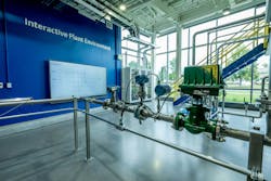 Figure 2: Emerson’s Boulder IPE houses a wide array of instrumentation and control equipment, along with a large-screen human-machine interface (HMI) for monitoring and controlling the process. Figure 2: Emerson’s Boulder IPE houses a wide array of instrumentation and control equipment, along with a large-screen human-machine interface (HMI) for monitoring and controlling the process.