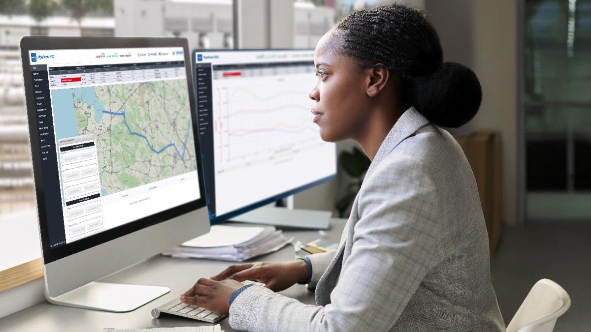 Pipe Patrol Neo woman in front of monitor