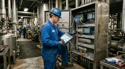 An engineer reviewing OT and control infrastructure in a brownfield process plant. An engineer reviewing OT and control infrastructure in a brownfield process plant.