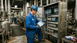 An engineer reviewing OT and control infrastructure in a brownfield process plant. An engineer reviewing OT and control infrastructure in a brownfield process plant.
