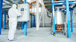 Chemical industry worker at control panel Chemical industry worker at control panel