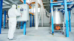 Chemical industry worker at control panel Chemical industry worker at control panel