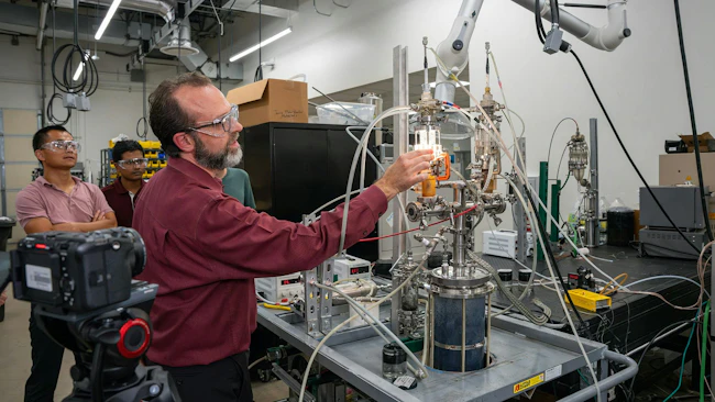 Dr. David Staack demonstrates the plasma-based reactor