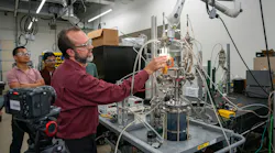 Dr. David Staack demonstrates the plasma-based reactor