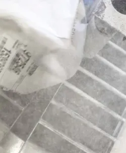 Bag dumping operation into an open hopper