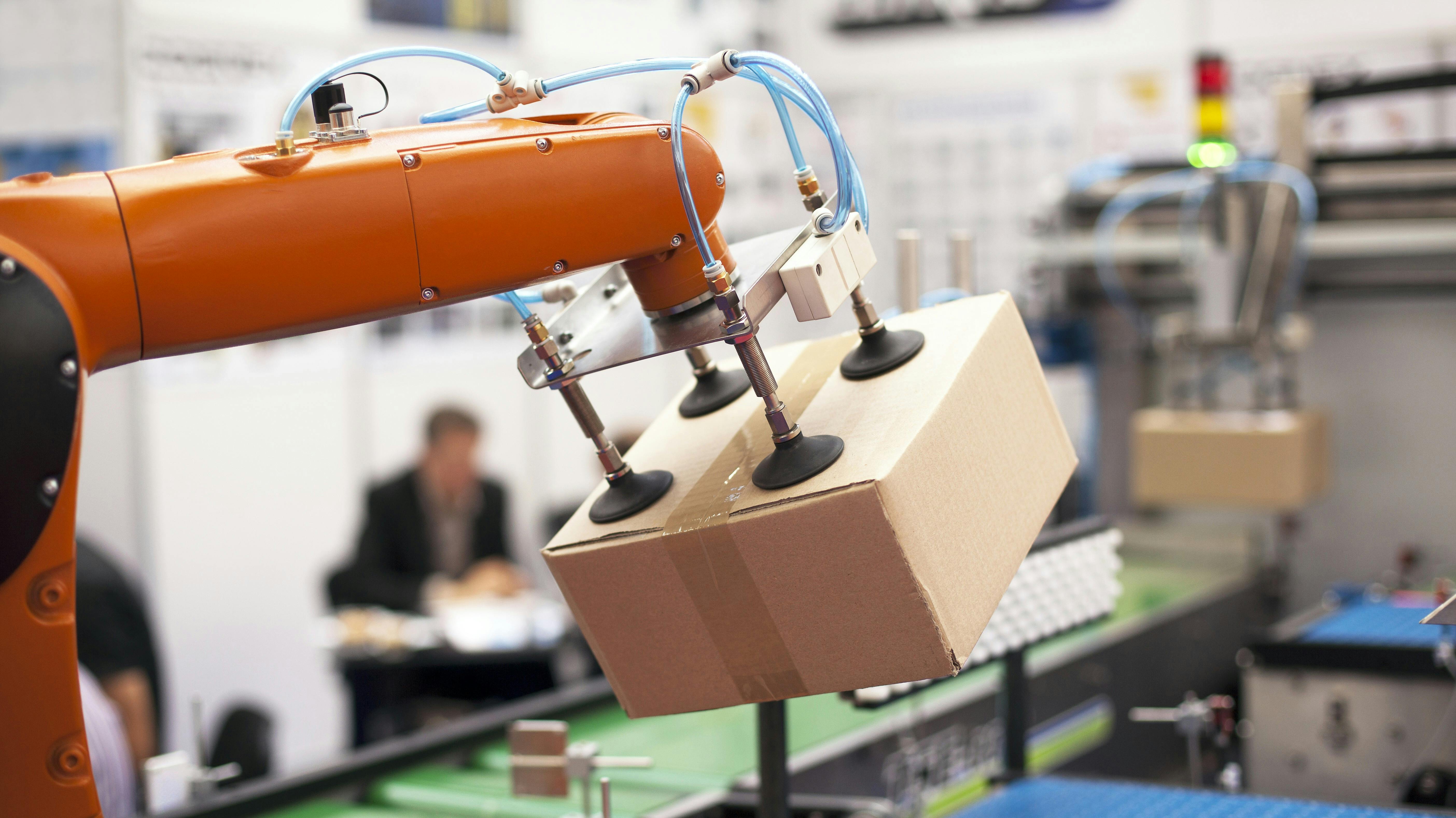 Robotic arm with package