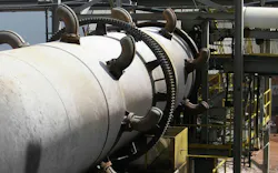 Ball and tube knockers on rotary dryer